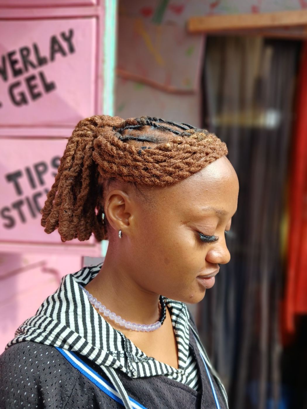 Dreadlock styling with colour accents